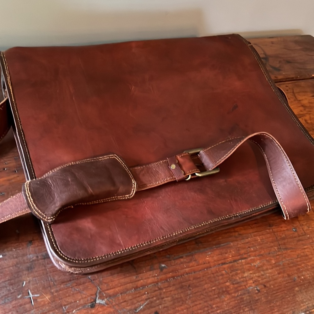 Leather messenger bag, never used no tags.